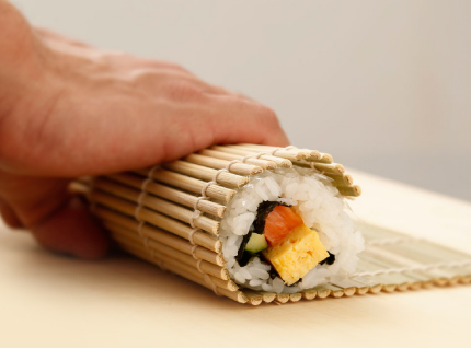 Add your favorite ingredients and roll the sushi
